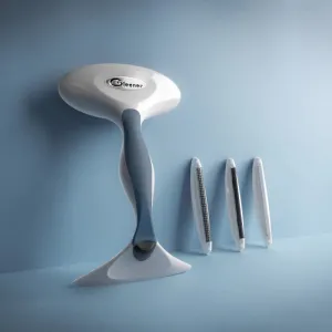 Rasoir et brosse anti-bouloches pour tissus vendu dans une boîte de carton