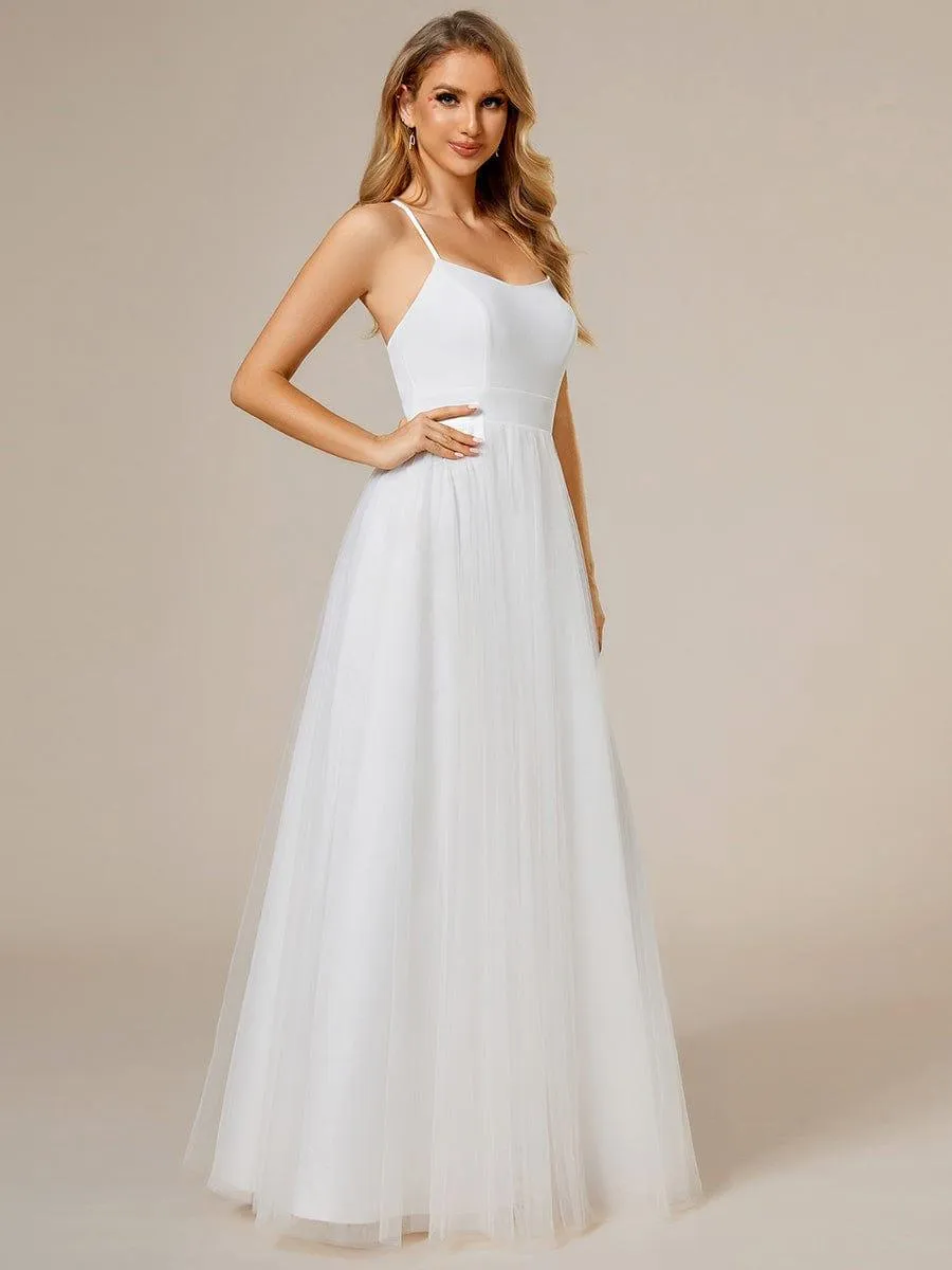Robe de mariée trapèze avec veste en dentelle et bretelles spaghetti