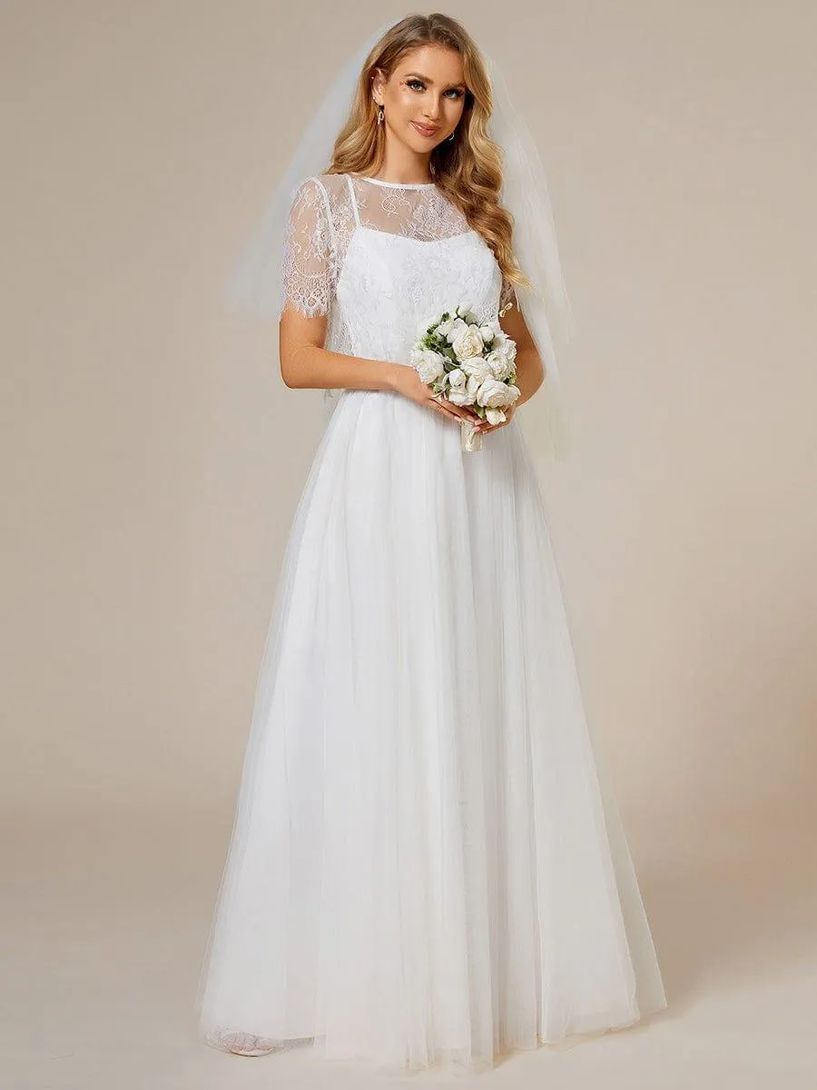 Robe de mariée trapèze avec veste en dentelle et bretelles spaghetti